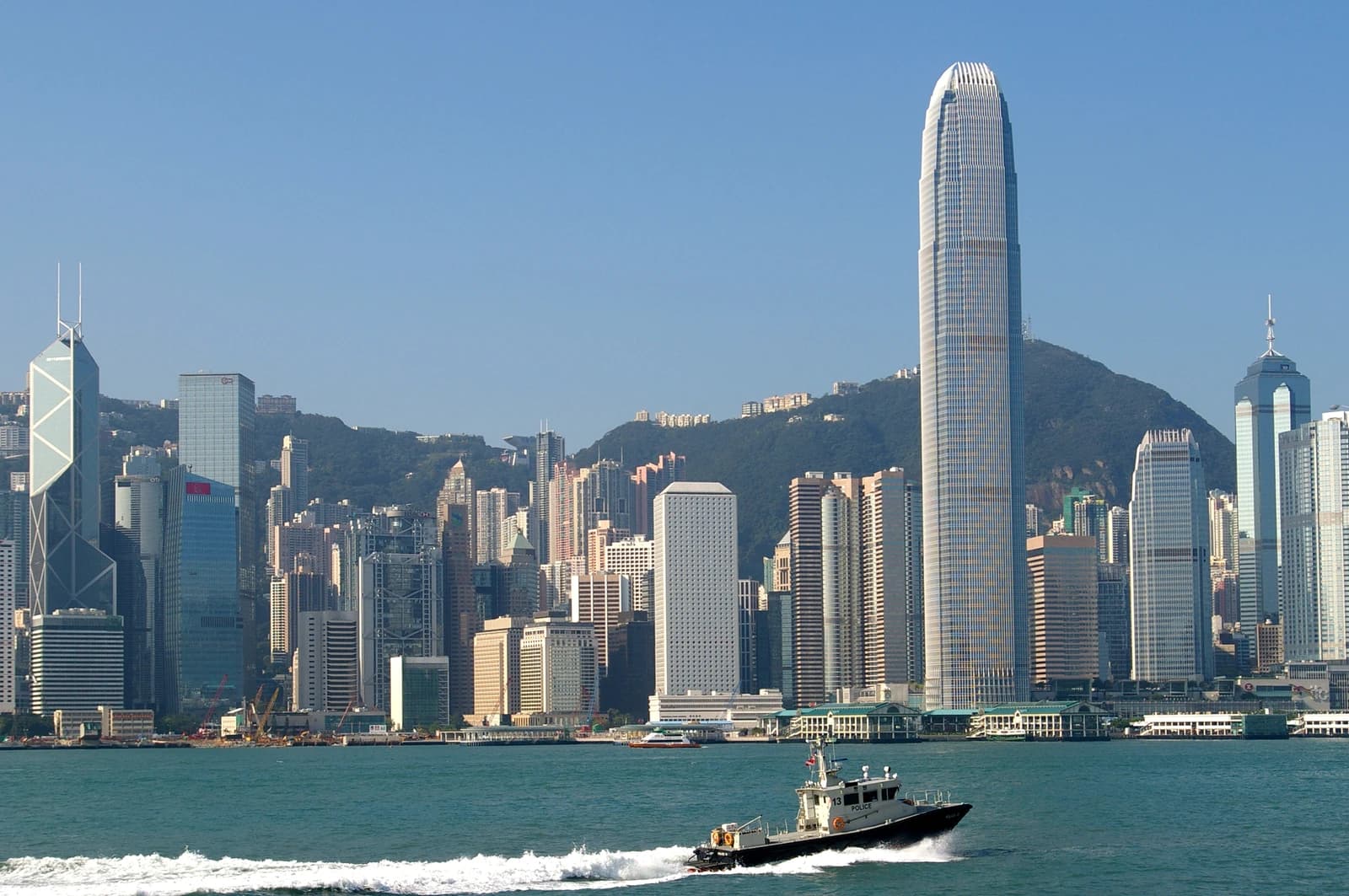 Hong Kong skyline with Victoria Harbour and many high-rise buildings.