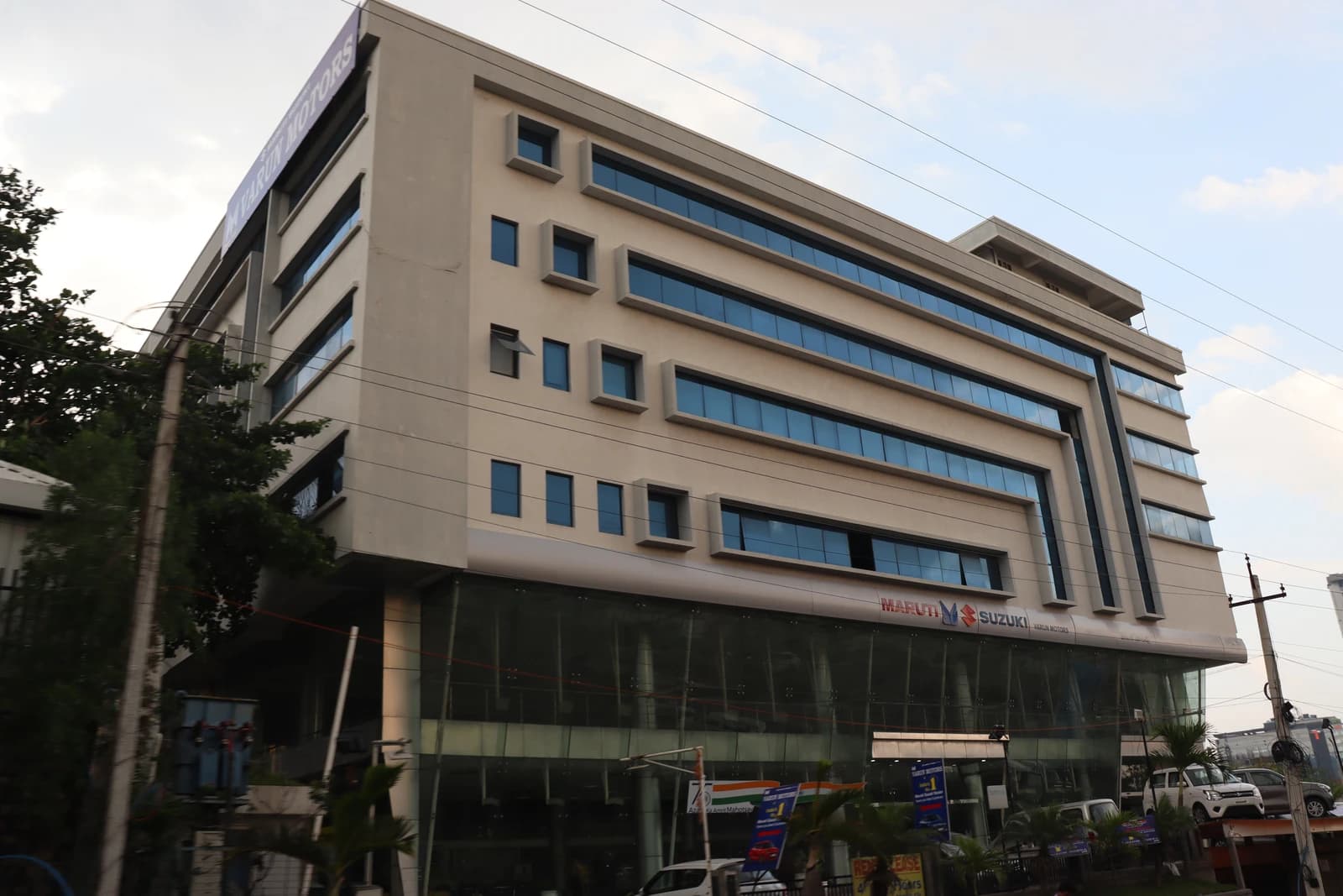 Exterior of Maruti Suzuki Varun Motors dealership in Hyderabad, India.