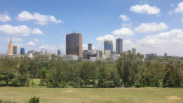 Nairobi's Central Business District skyline featuring multiple modern skyscrapers and green park.