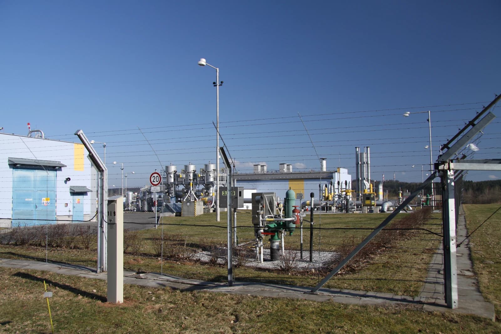 Exterior view of the Haje underground gas storage facility showing buildings and pipelines.