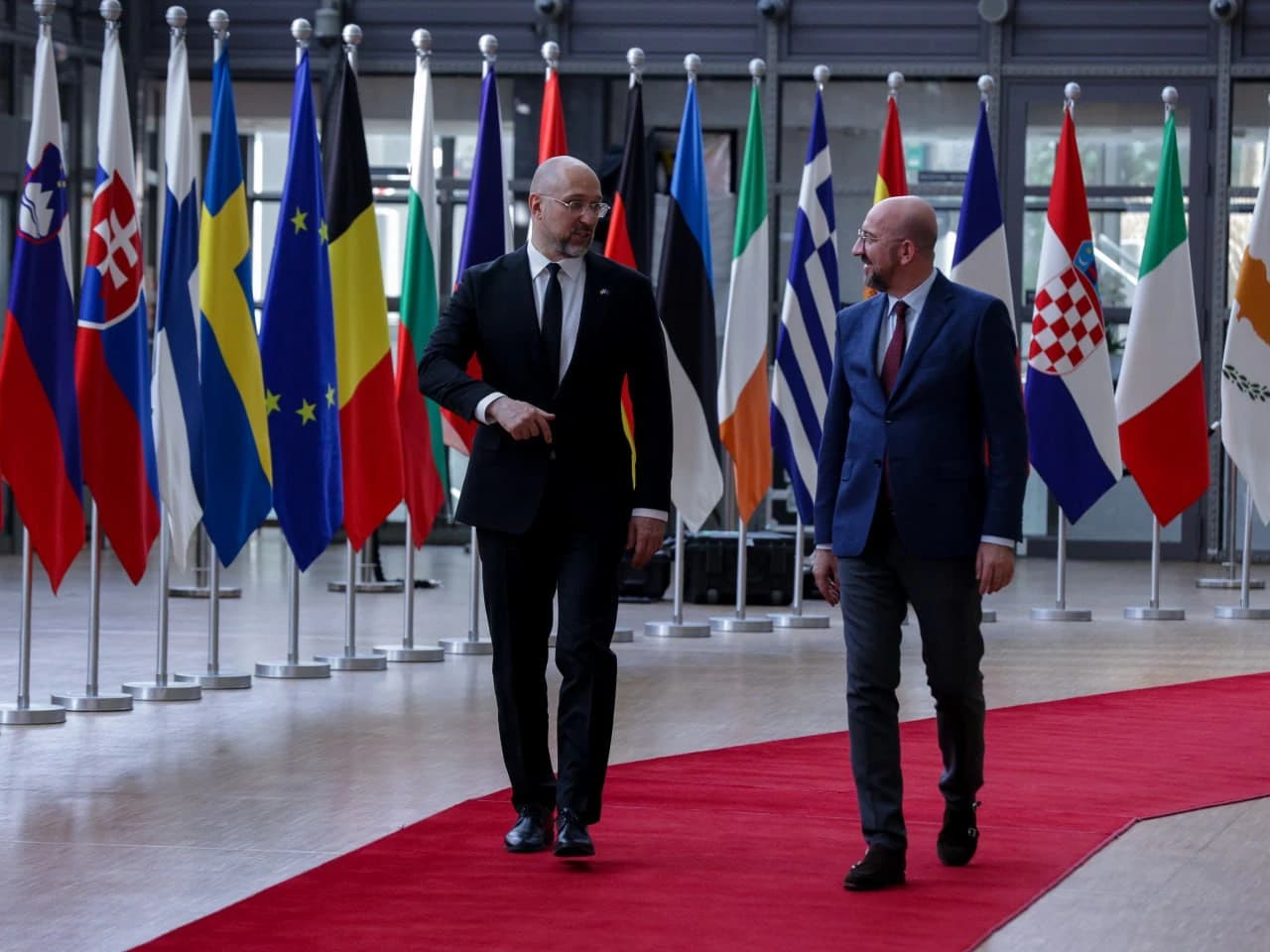 Denys Shmyhal, Prime Minister of Ukraine, walks with Charles Michel, President of the European Council.
