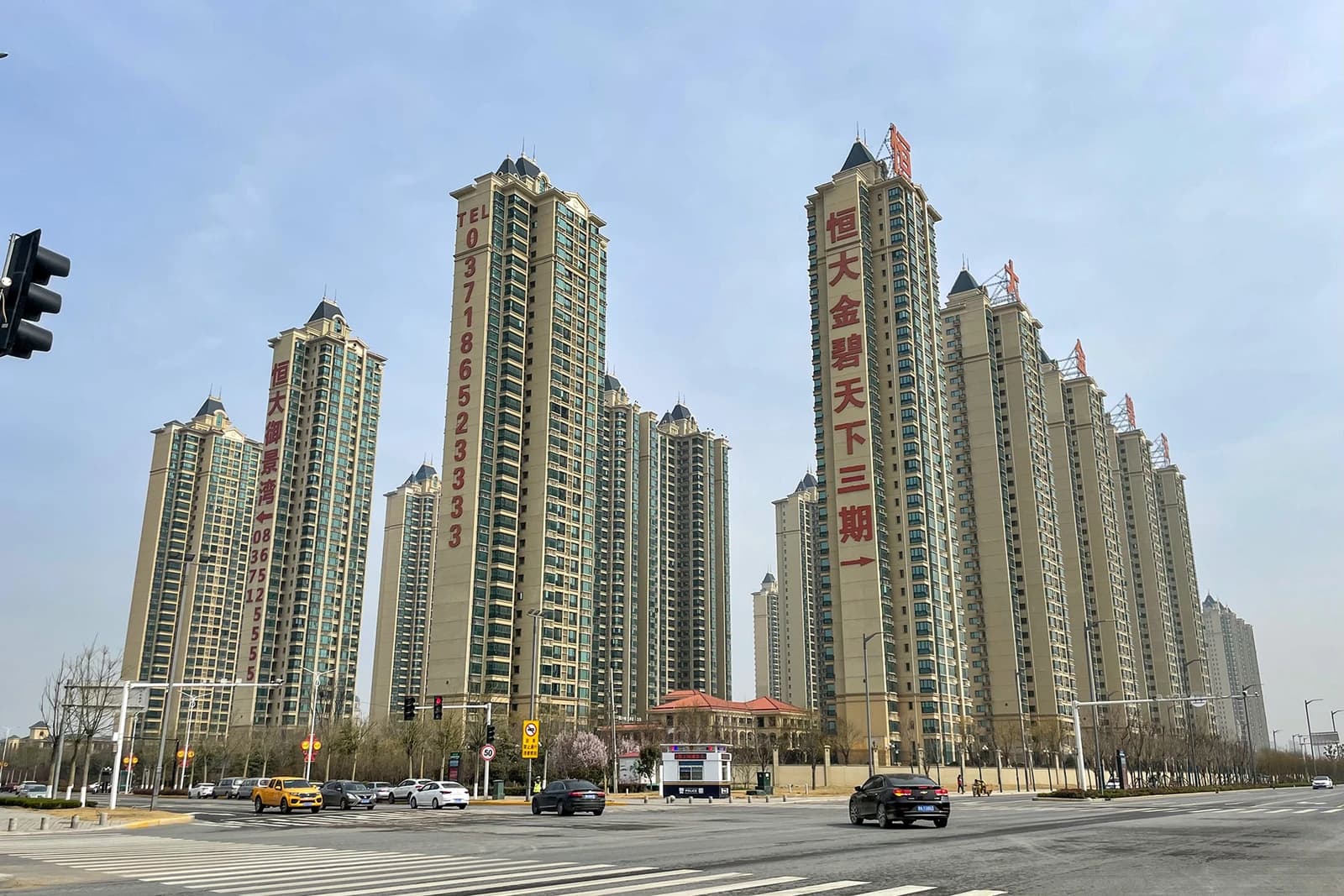 Residential buildings developed by Evergrande in Yuanyang, China, with promotional banners.