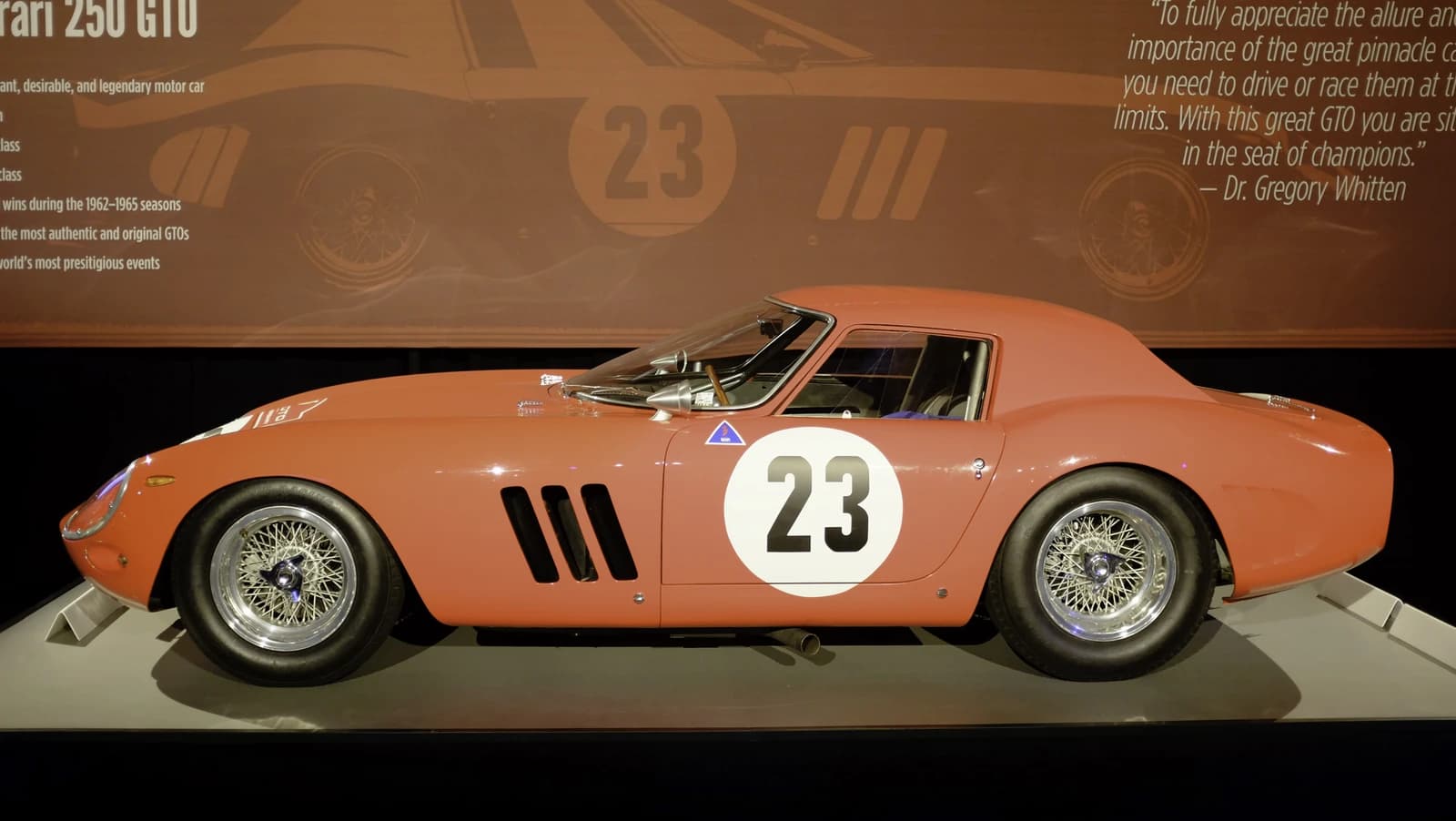 Side view of a vintage Ferrari 250 GTO race car on display.