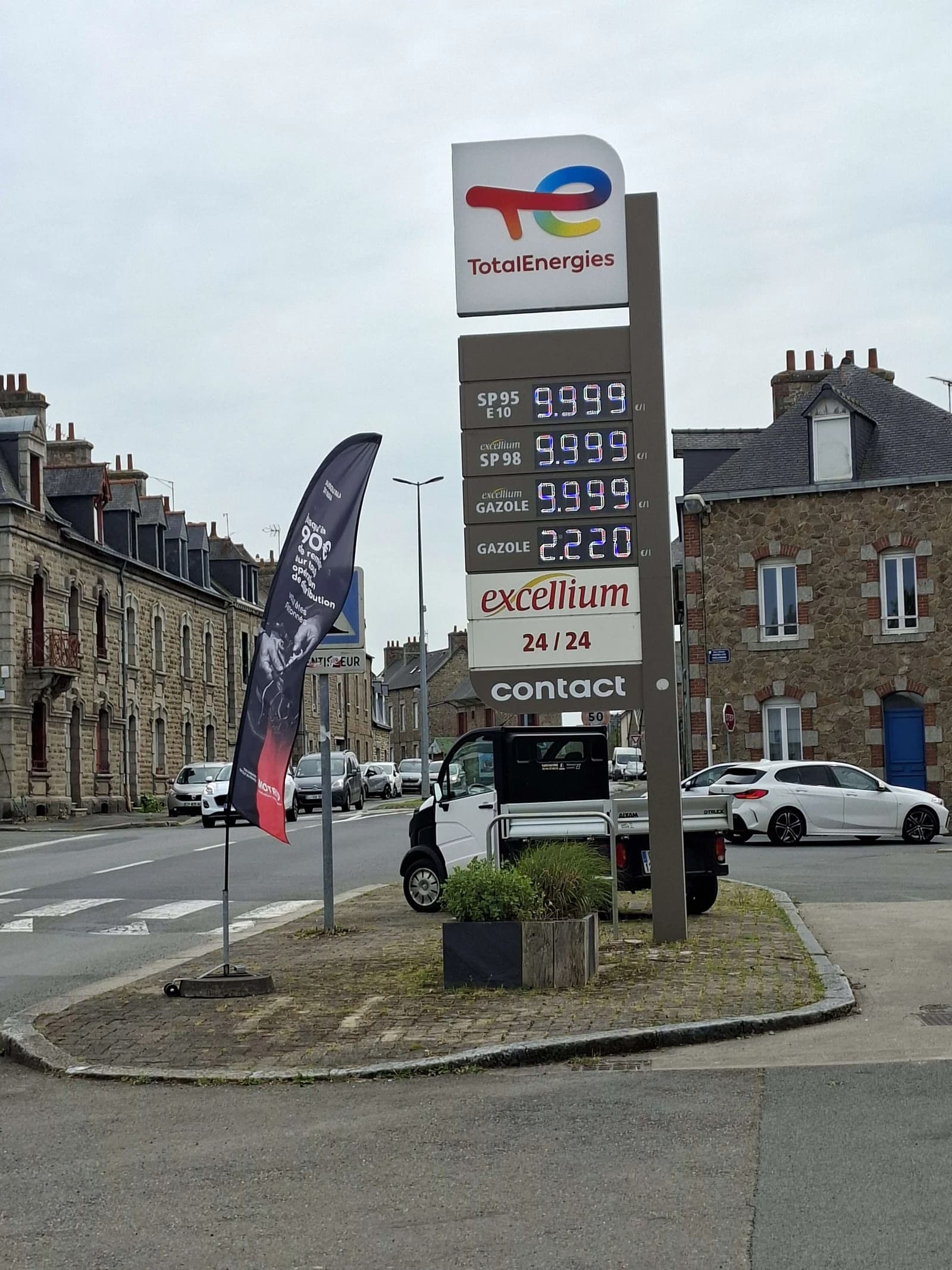 TotalEnergies sign displaying high fuel prices at a gas station in France.