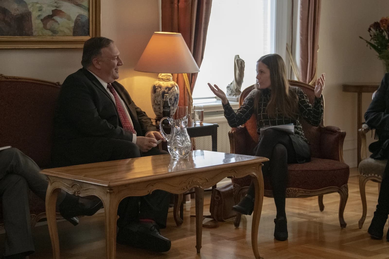 Secretary Pompeo and Iceland Prime Minister Jakobsdottir seated, facing each other and conversing.
