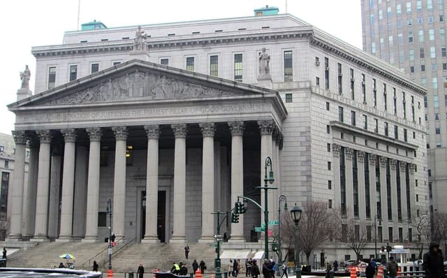 New York State Supreme Courthouse building from the southwest, showing columns and facade.