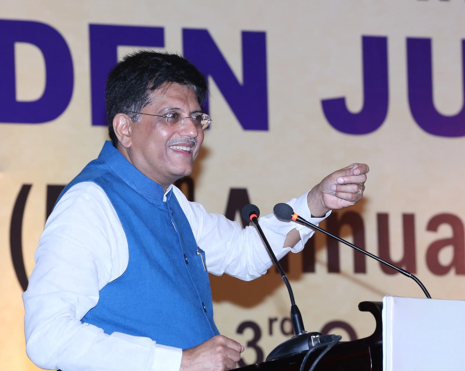 Piyush Goyal, then Minister of Railways and Coal, addressing an audience at a podium.