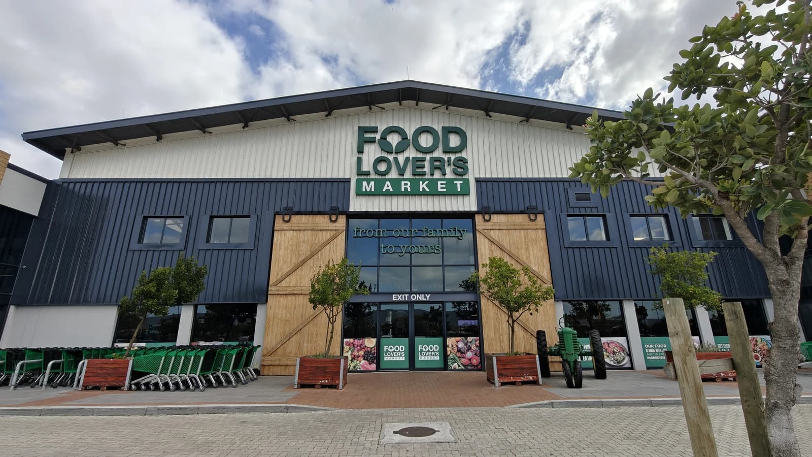 Food Lover's Market storefront with 'from our family to yours' above the entrance.