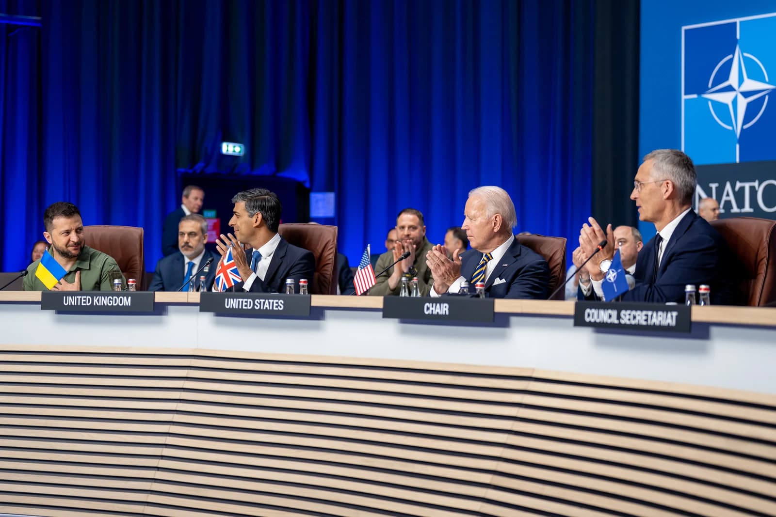 President Volodymyr Zelenskyy sits with President Joe Biden and other G7 leaders at a summit.