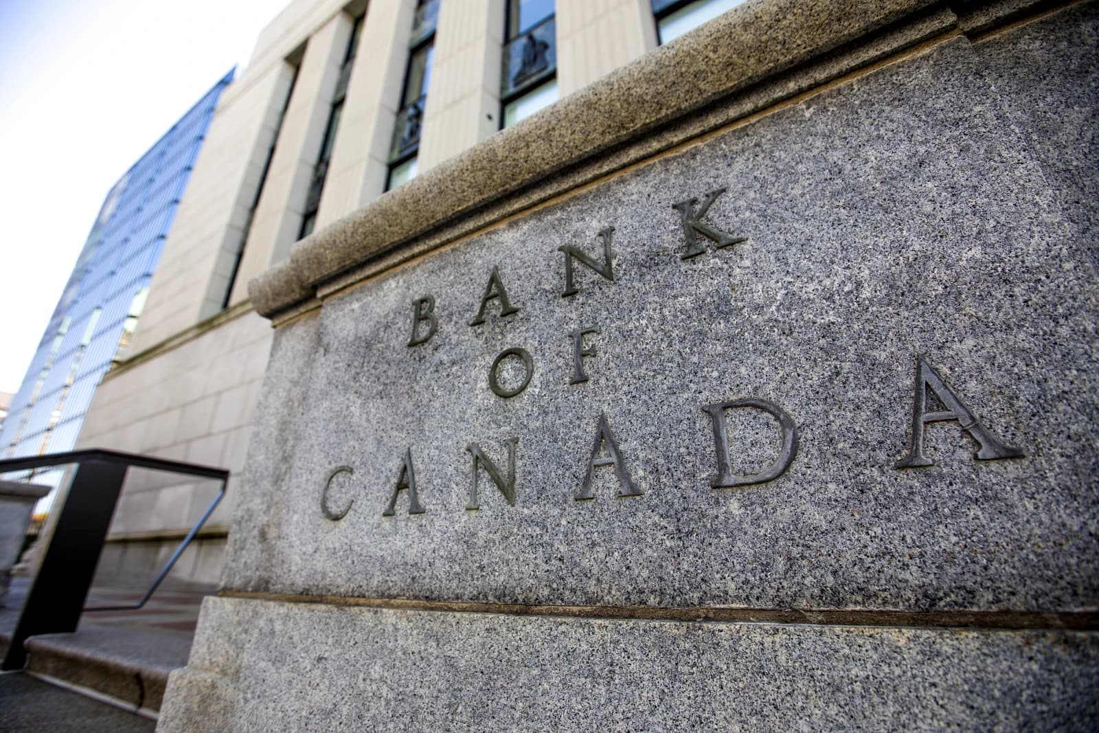 Bank of Canada name carved into the stone facade of its head office building.