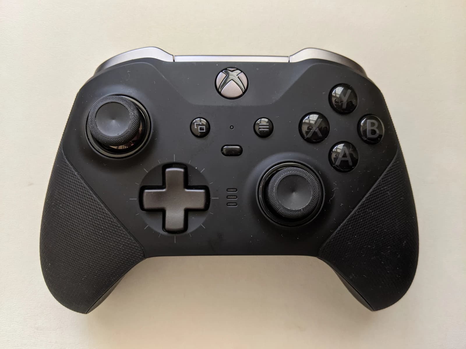 An Xbox One Elite Wireless Controller Series 2 against a light background.