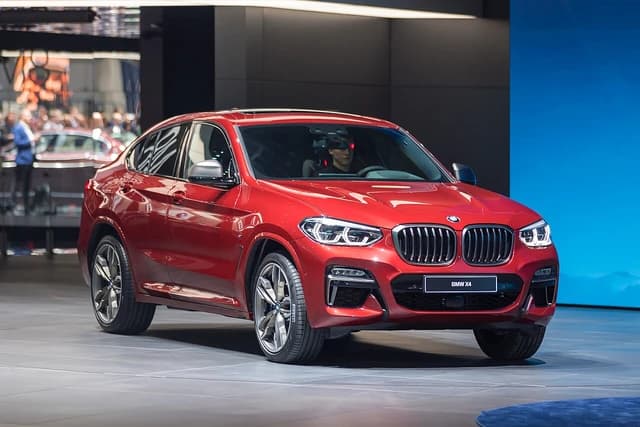 A red BMW X4 car on display at the Geneva International Motor Show.