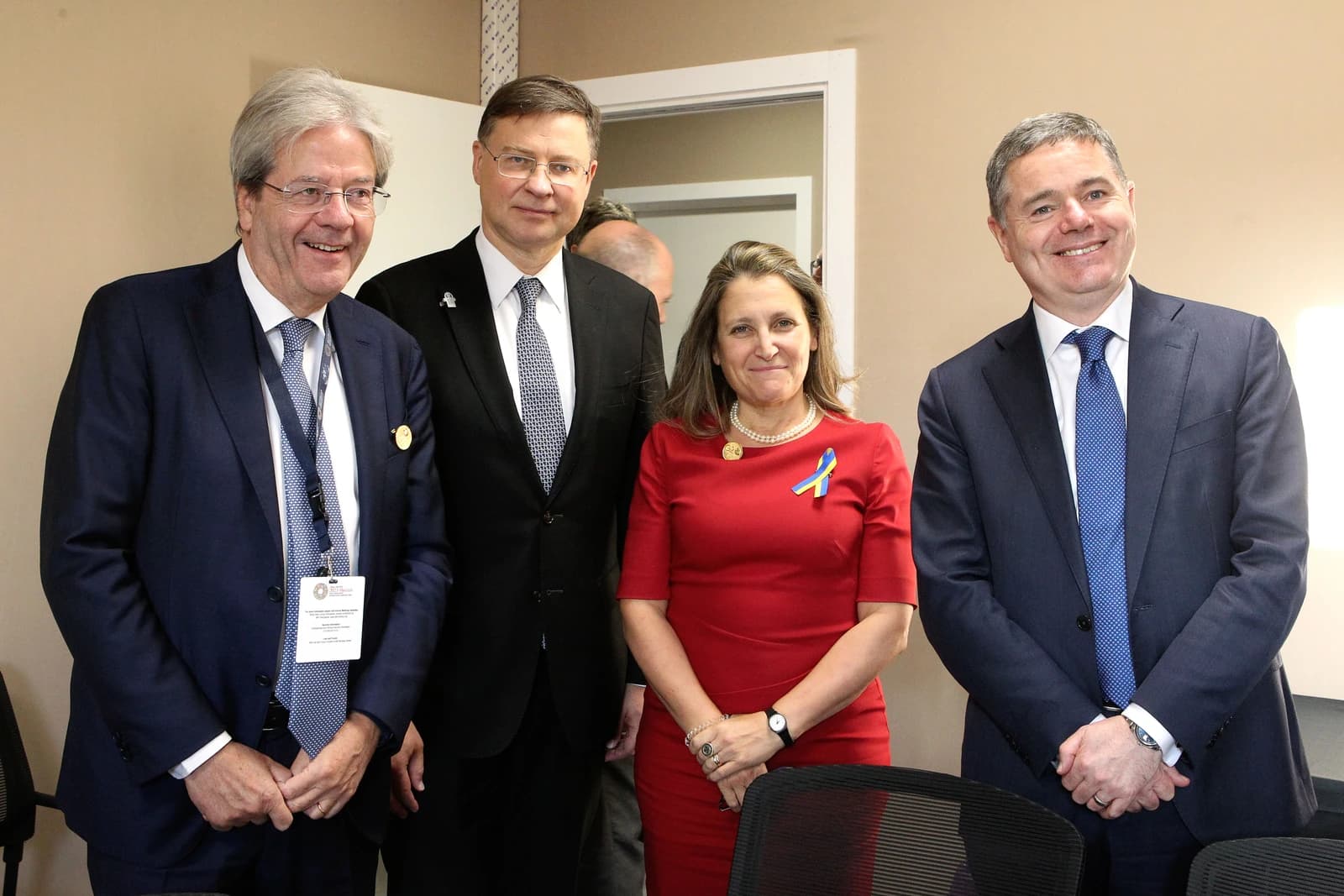 Four officials standing together and smiling at the World Bank and IMF meetings.