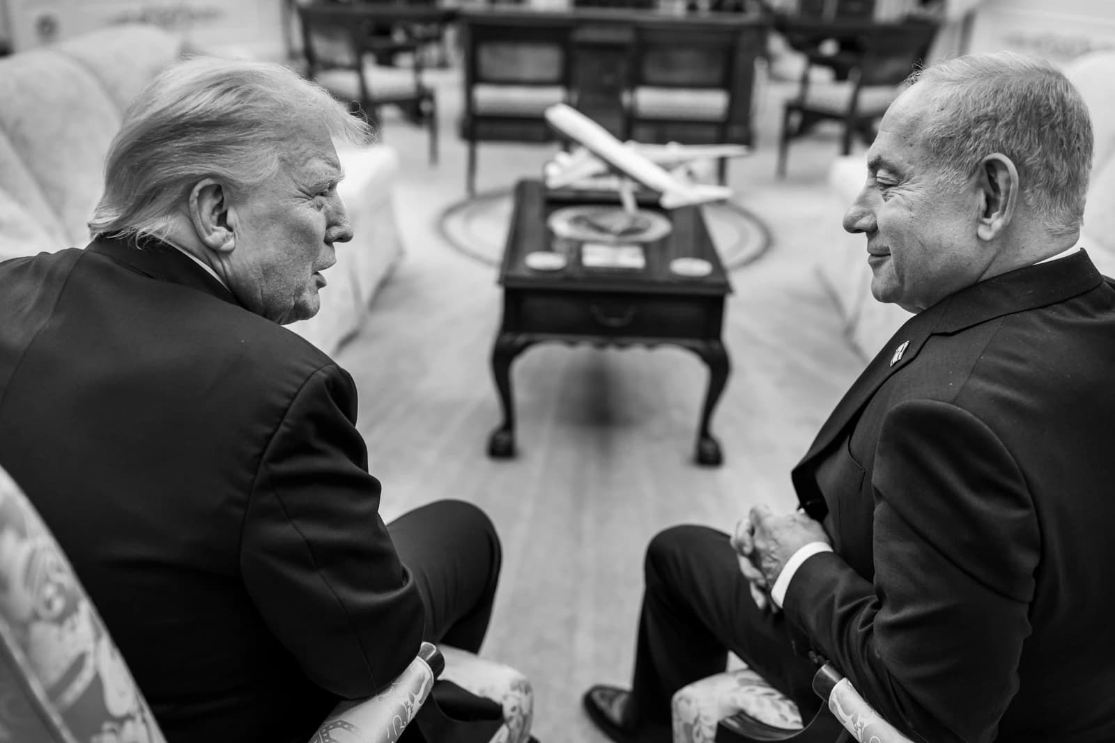 President Donald Trump and Israeli Prime Minister Benjamin Netanyahu seated, facing each other.