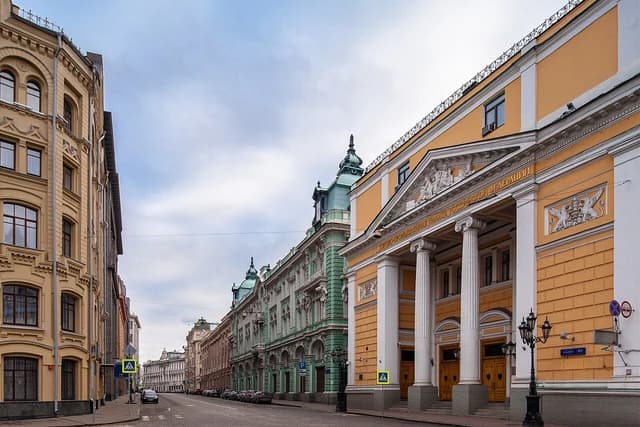 Buildings on Birzhevaya Square and Ilyinka Street in Moscow on an overcast day.