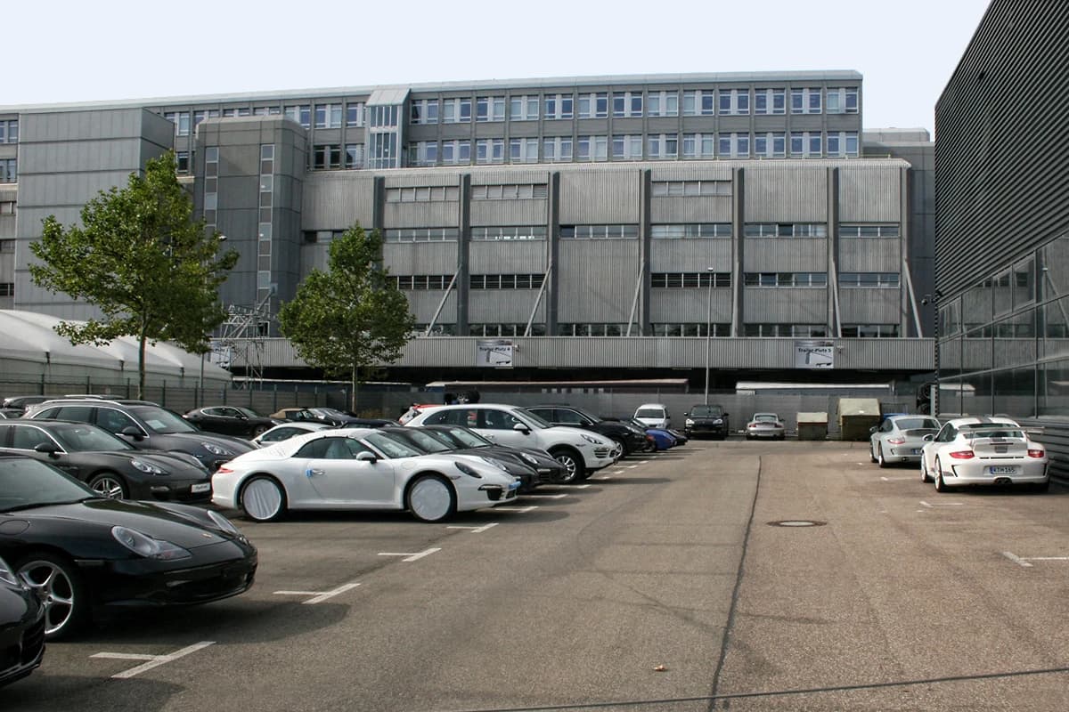Porsche vehicles parked in a lot outside the Zuffenhausen factory in Stuttgart, Germany.
