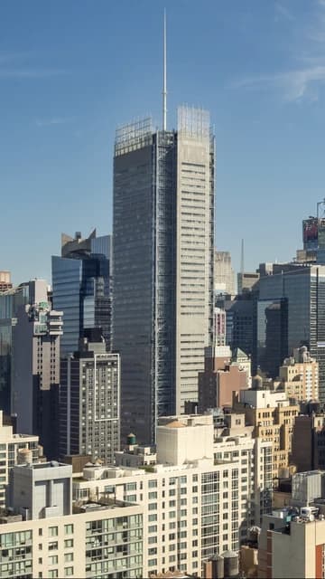 The New York Times Building rises above other skyscrapers in a Manhattan cityscape.