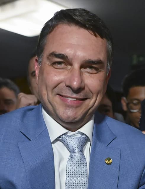 Flavio Bolsonaro, Brazilian politician, smiling and looking towards the camera.