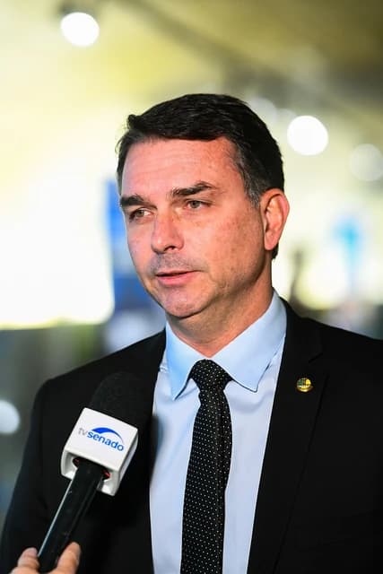 Flavio Bolsonaro, a Brazilian Senator, speaking into a microphone.