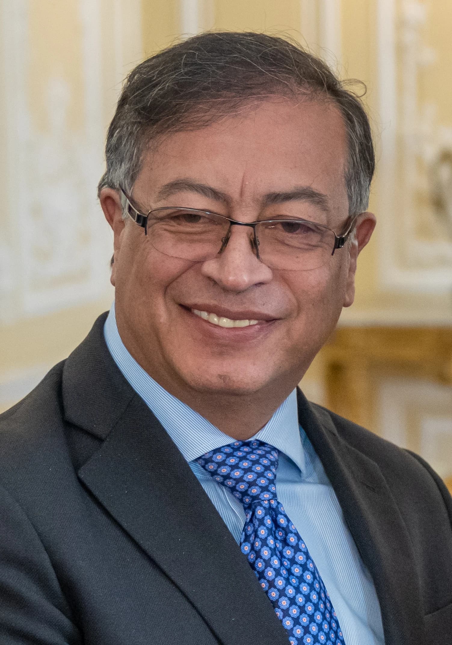 Gustavo Petro, President of Colombia, smiling in a formal setting.