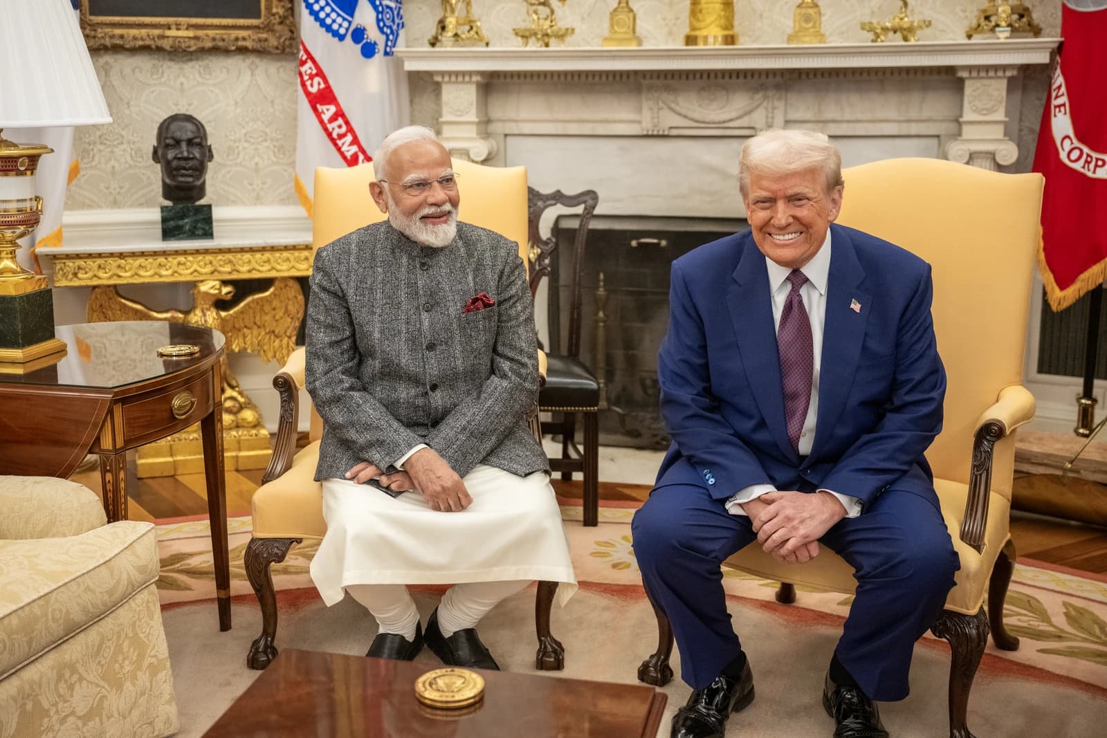 Indian Prime Minister Narendra Modi and US President Donald Trump seated, smiling at each other.
