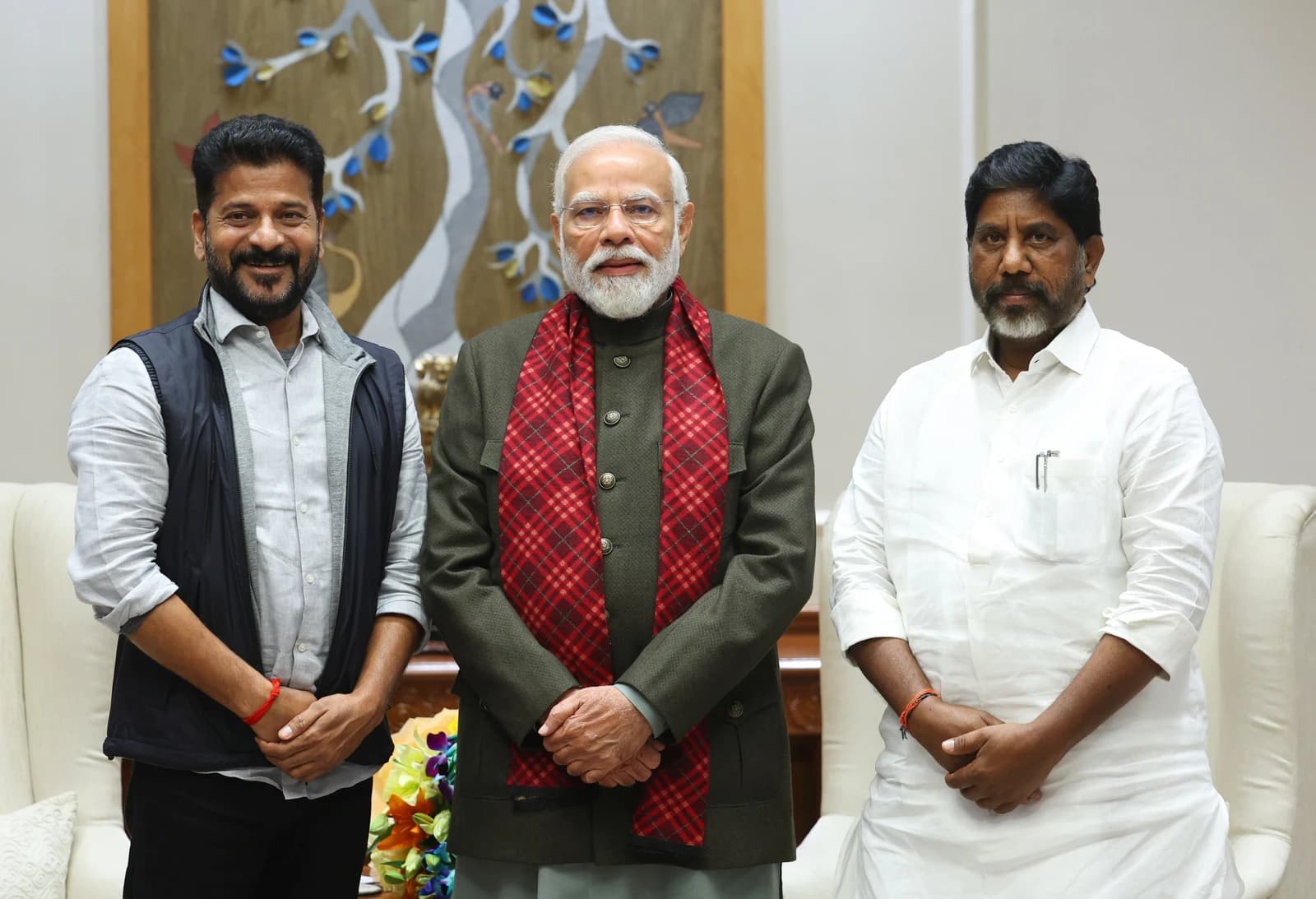 Telangana CM Revanth Reddy, PM Narendra Modi, and Telangana Deputy CM Bhatti Vikramarka Mallu standing together.