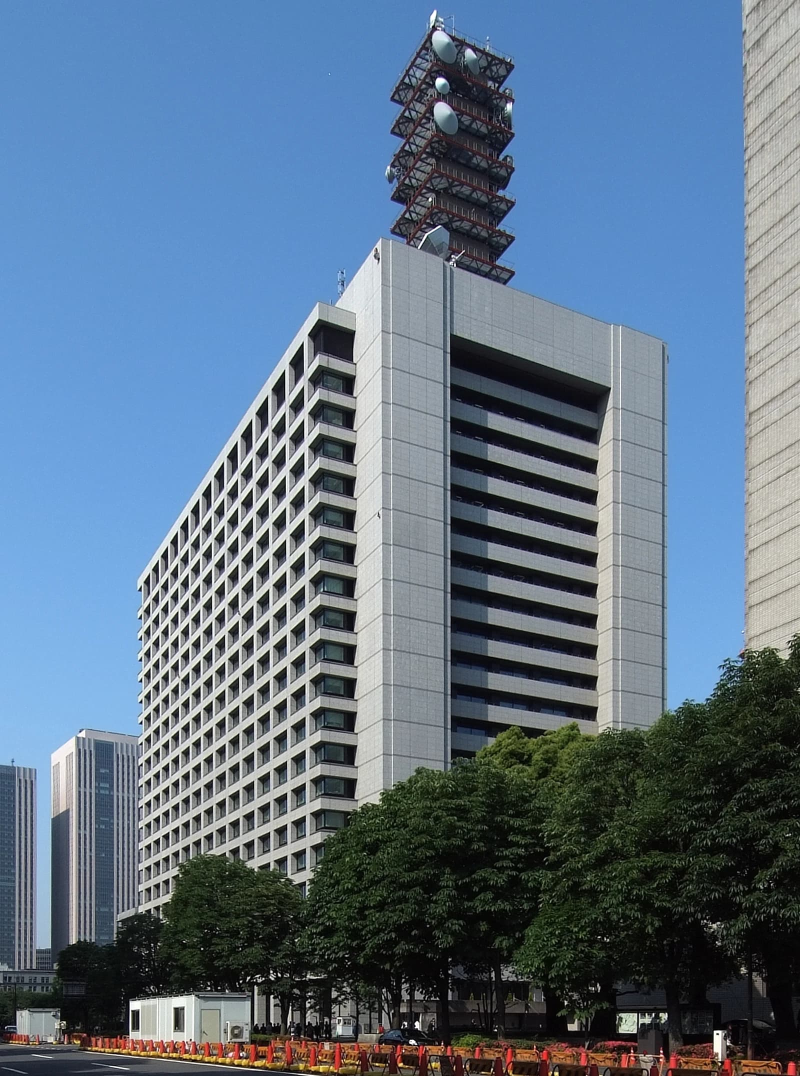 Government Office Complex 2 building in Japan with a communication tower on top.