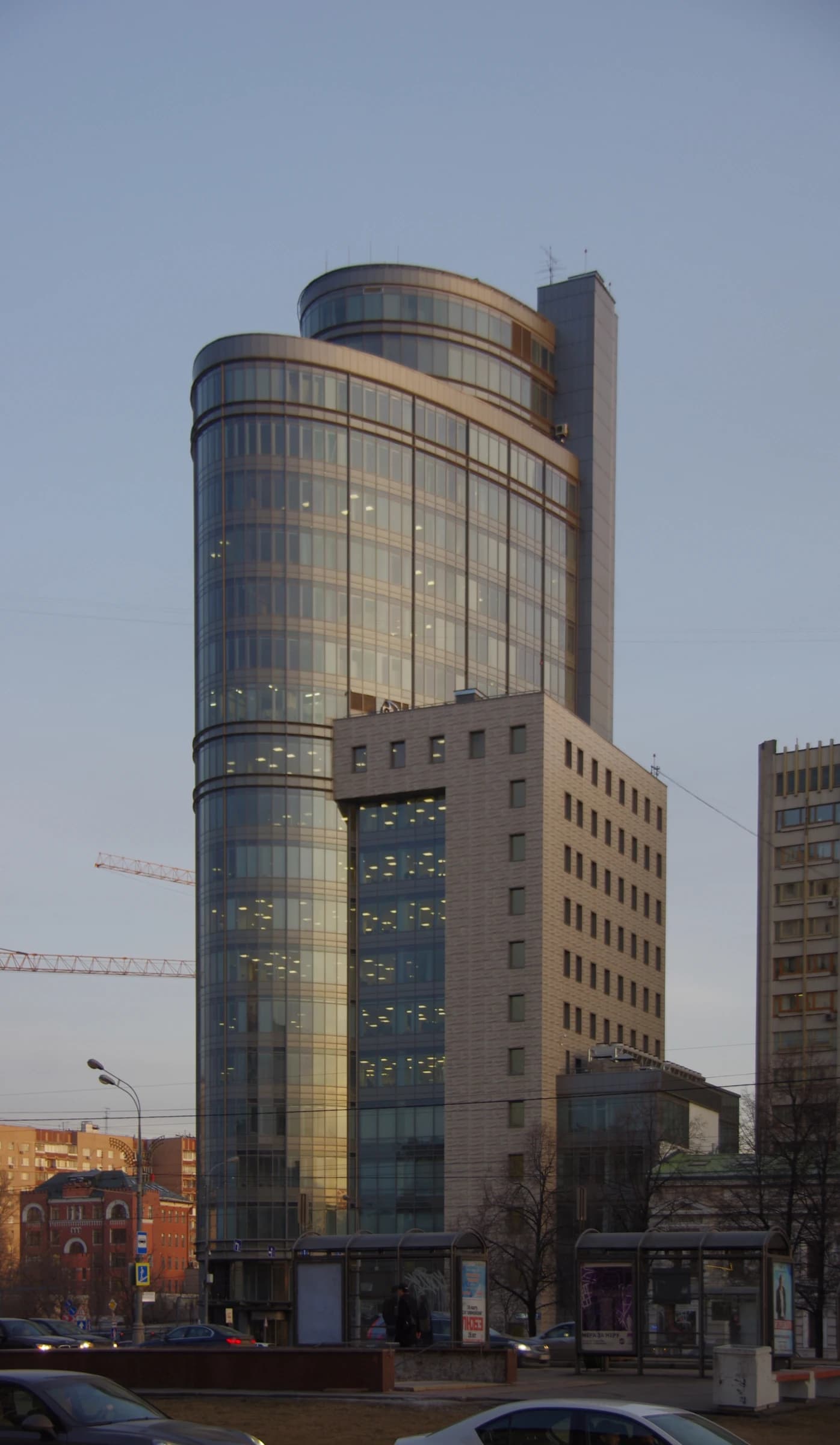 Modern office building with curved glass facade in Yakimanka District, Moscow, Russia.