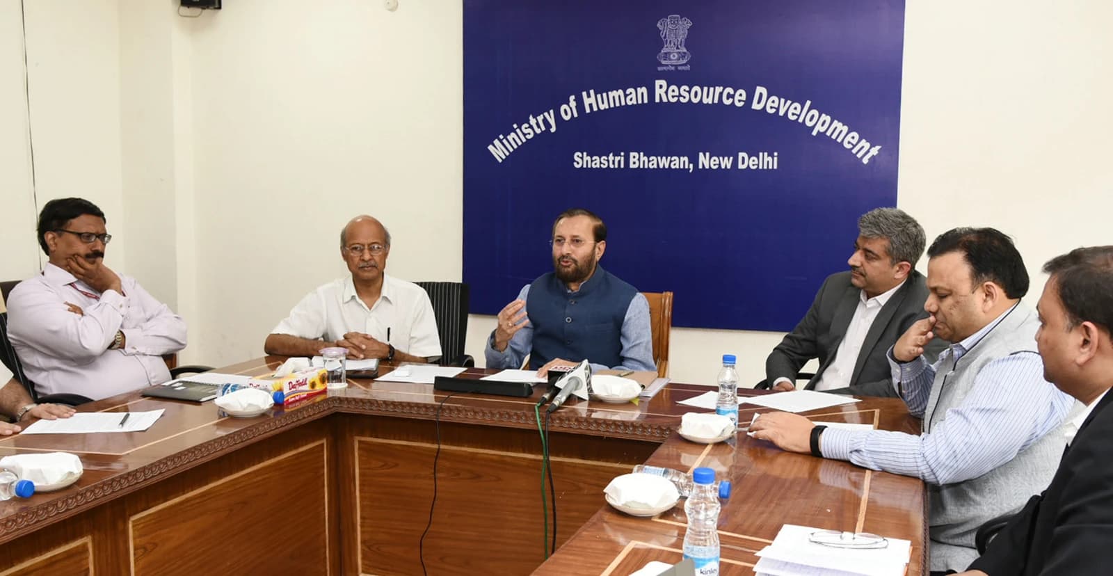Prakash Javadekar, former Minister of Human Resource Development, speaking at a conference table.
