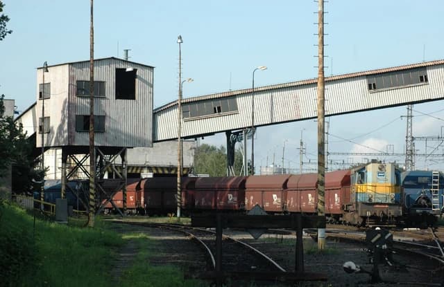 Freight train with brown coal wagons at the AWT Odra coal service facility.