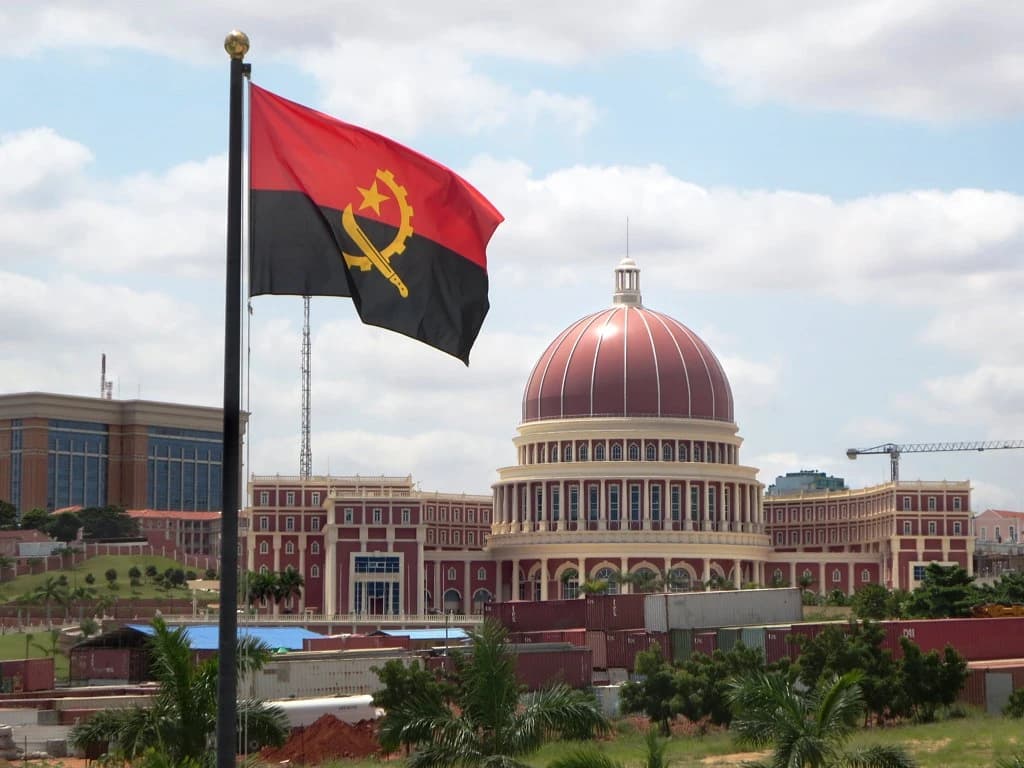 Angolan flag flying in front of the National Assembly building in Luanda, Angola.