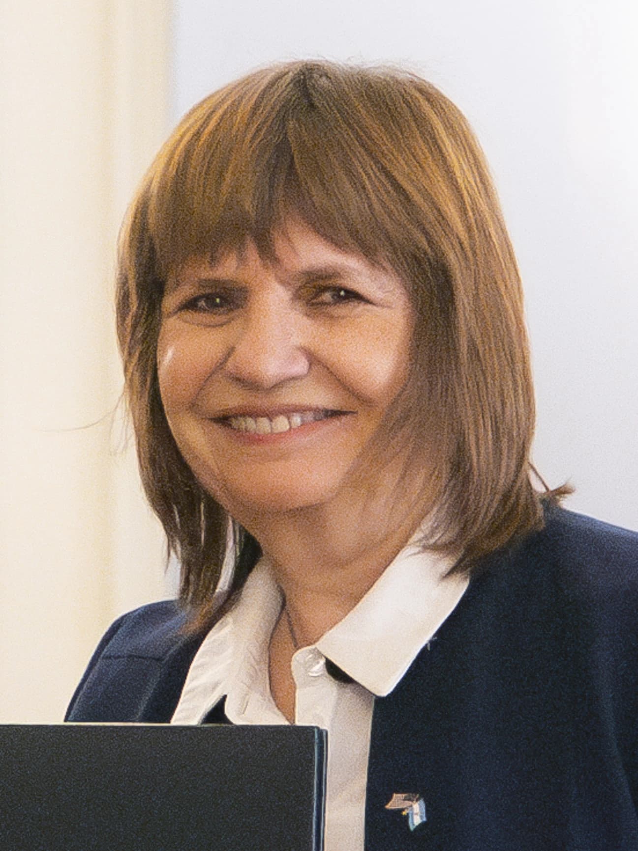Patricia Bullrich, Minister of National Security of Argentina, smiling at the Casa Rosada.