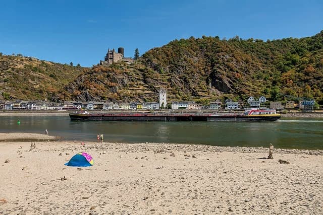 Barge Stolt Ludwigshafen navigates the shallow Rhine River past Sankt Goarshausen, Germany.