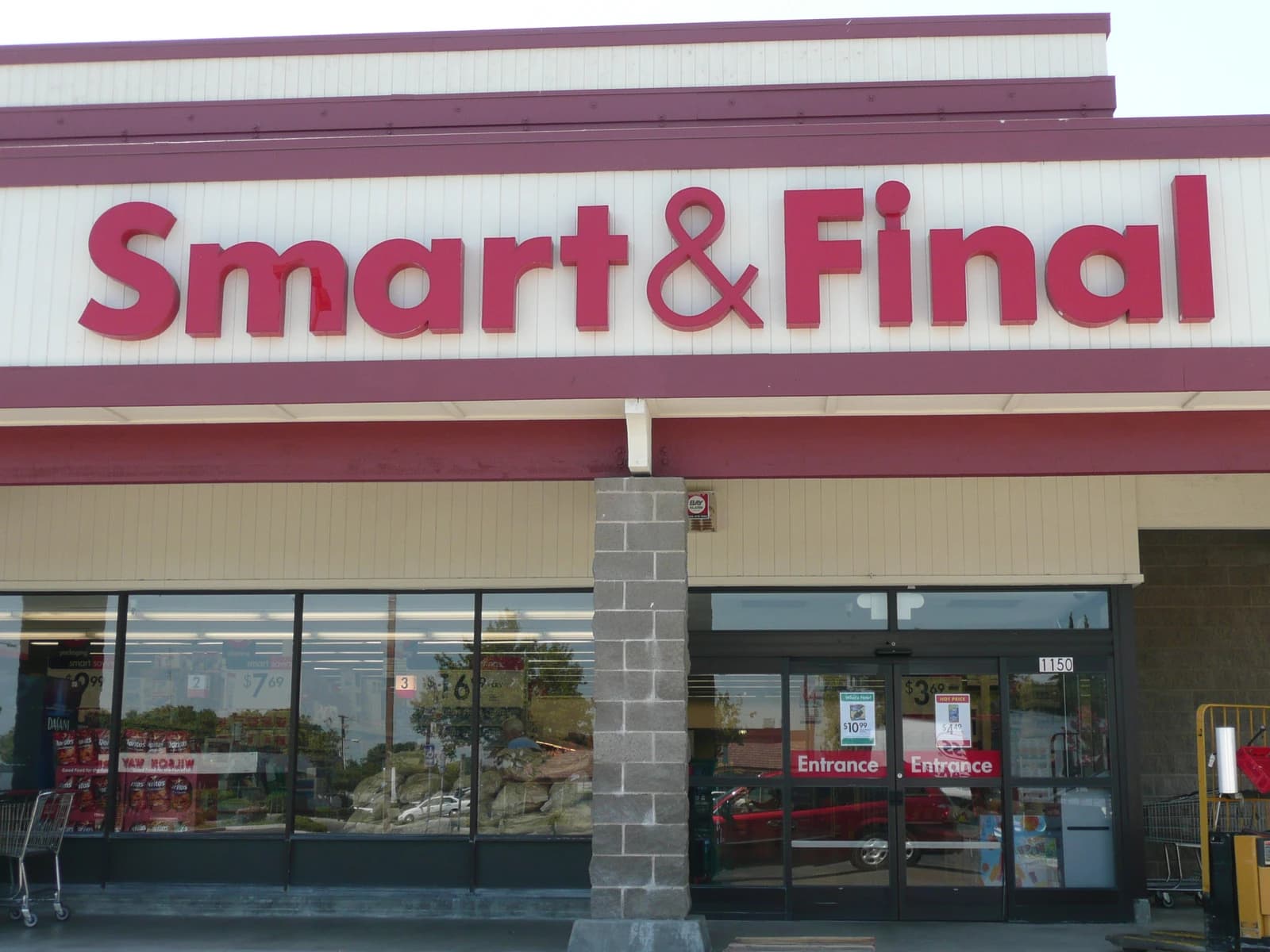 Entrance to a Smart & Final grocery store with red signage.