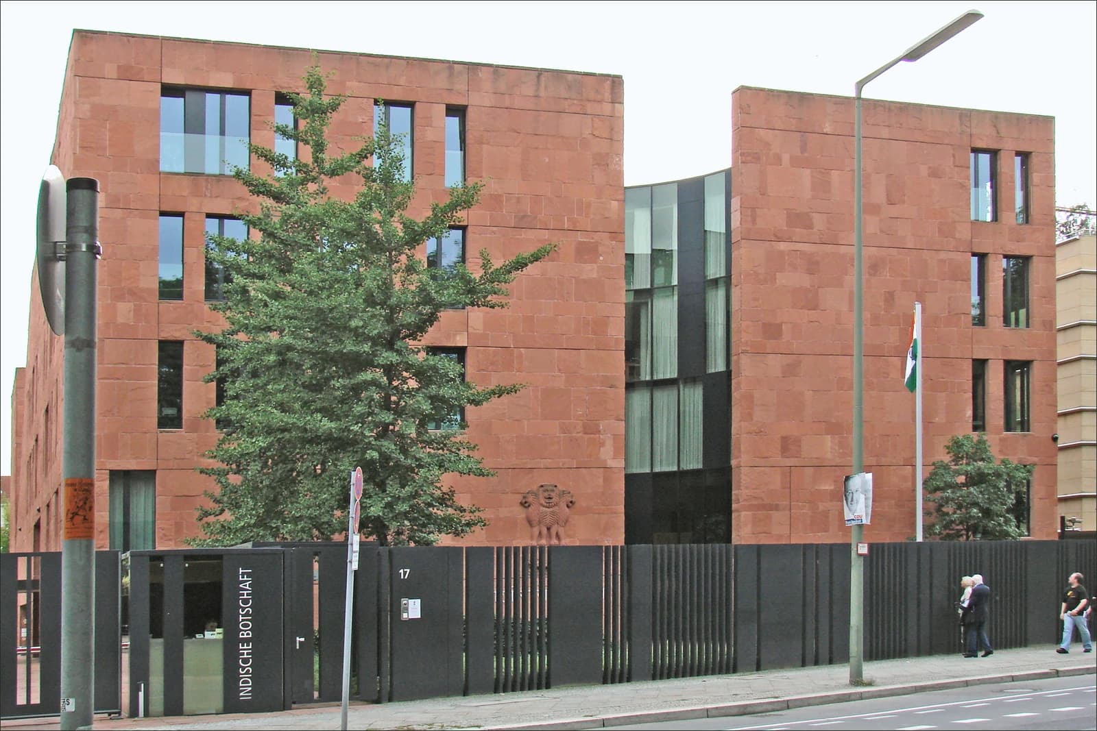 Exterior view of the Embassy of India in Berlin, with an Indian flag flying outside.
