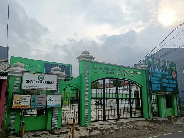 Exterior facade and entrance gate of Al-Khairaat Junior High School in East Jakarta.