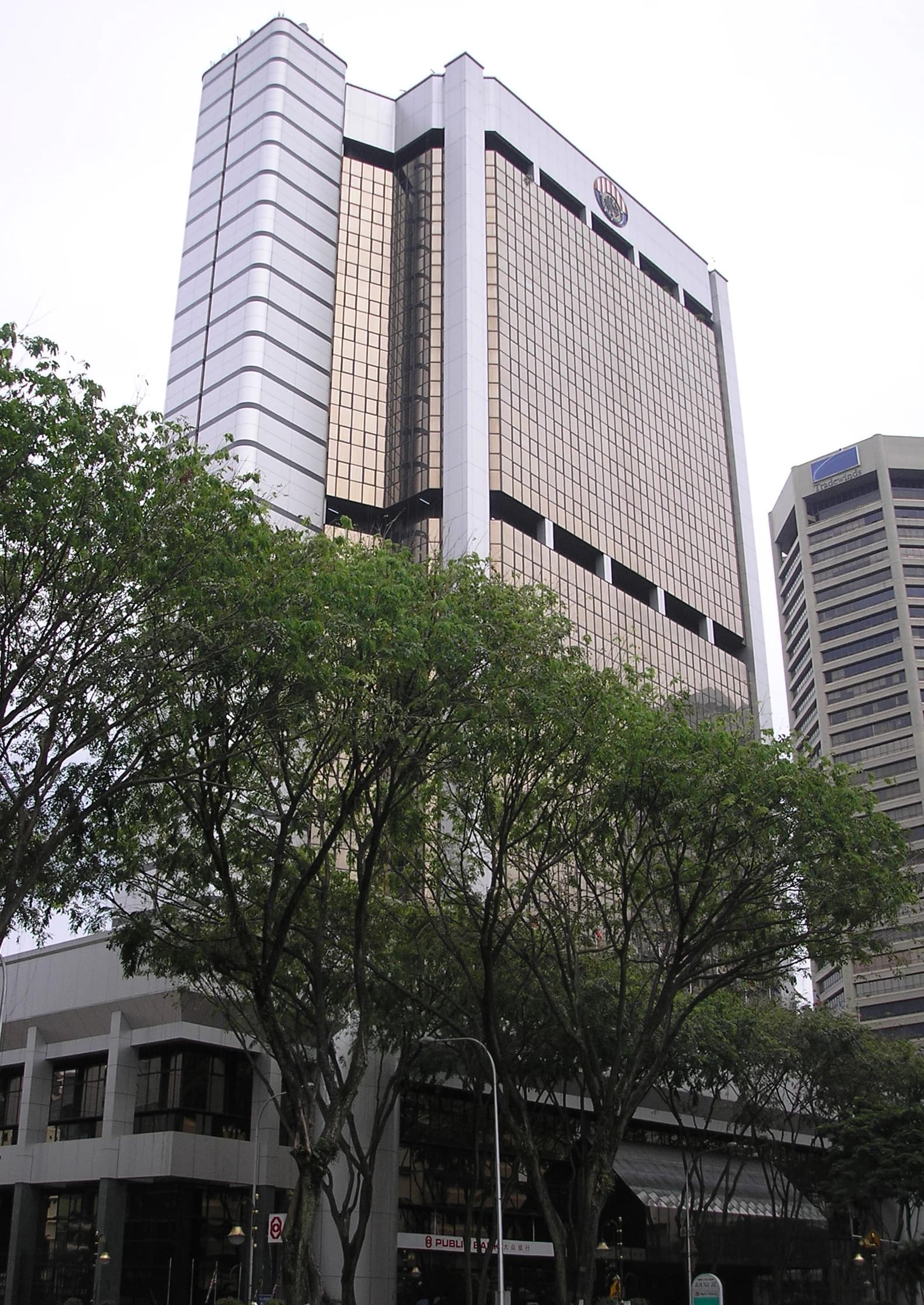 Employees Provident Fund headquarters building, a tall structure with gold-tinted windows, in Kuala Lumpur.