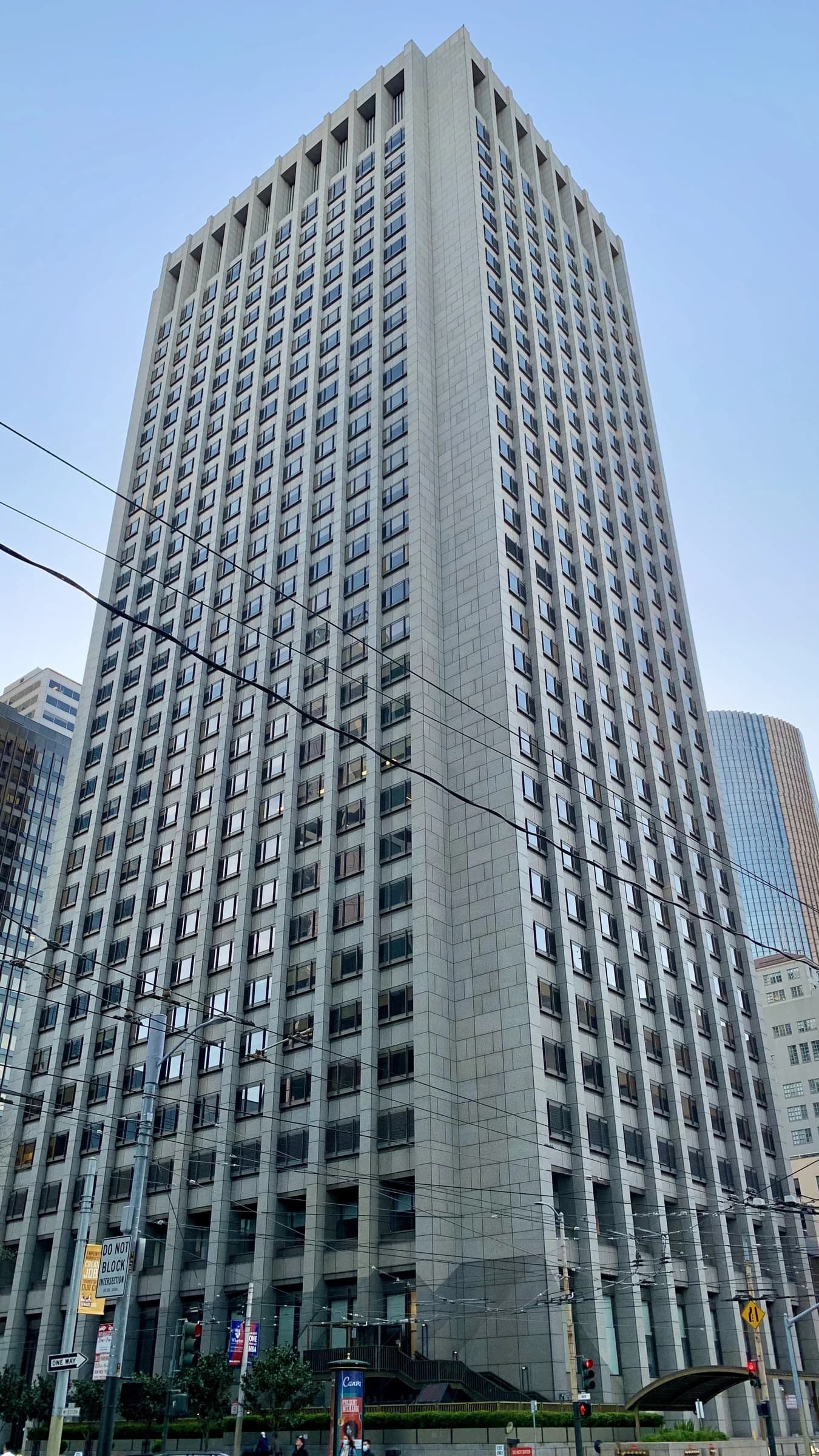 Exterior of the Pacific Gas & Electric Building, a tall grey skyscraper with many windows.