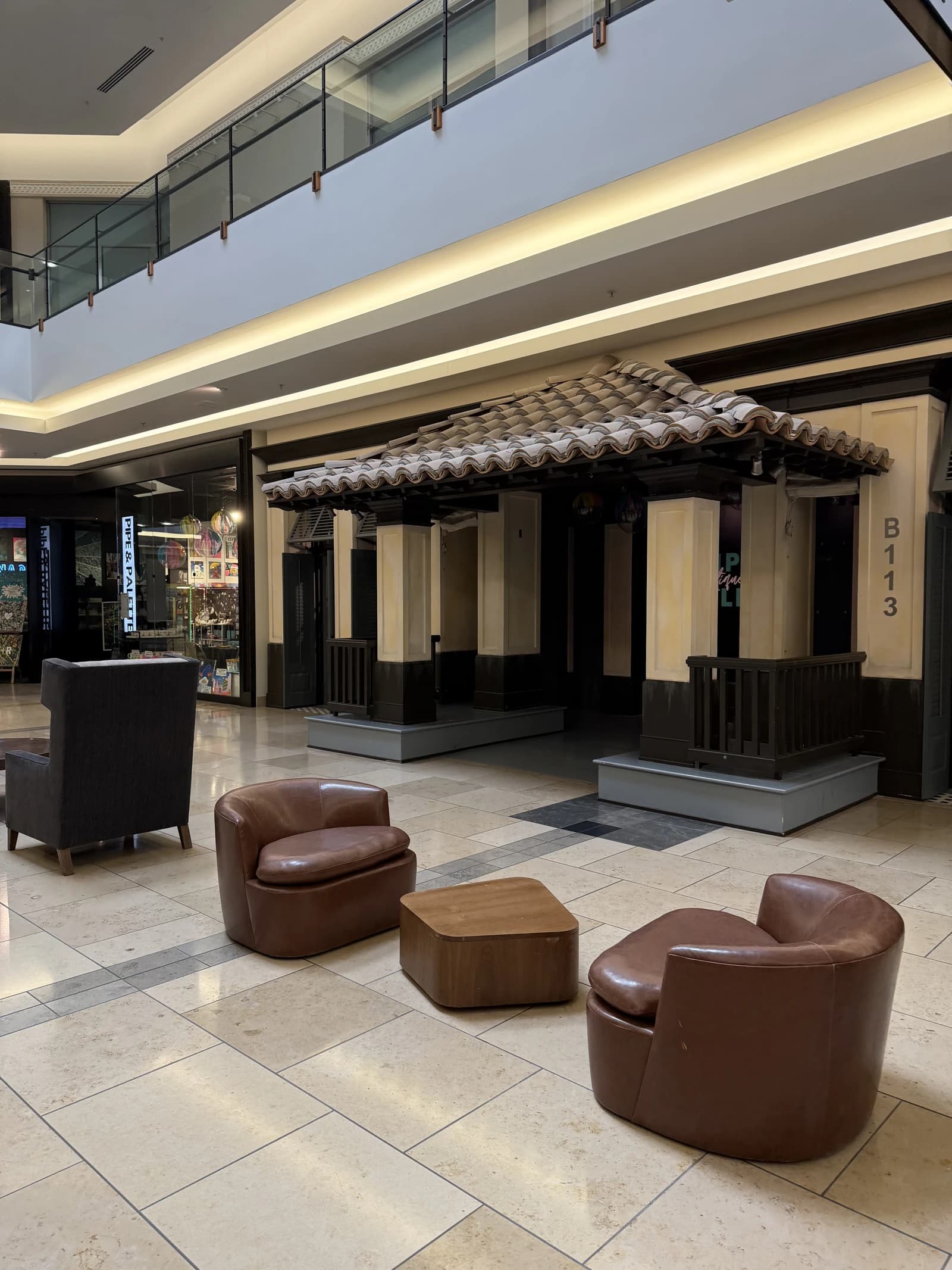 Empty storefront with chairs in front of vacant retail space at The Shops at Willow Bend.