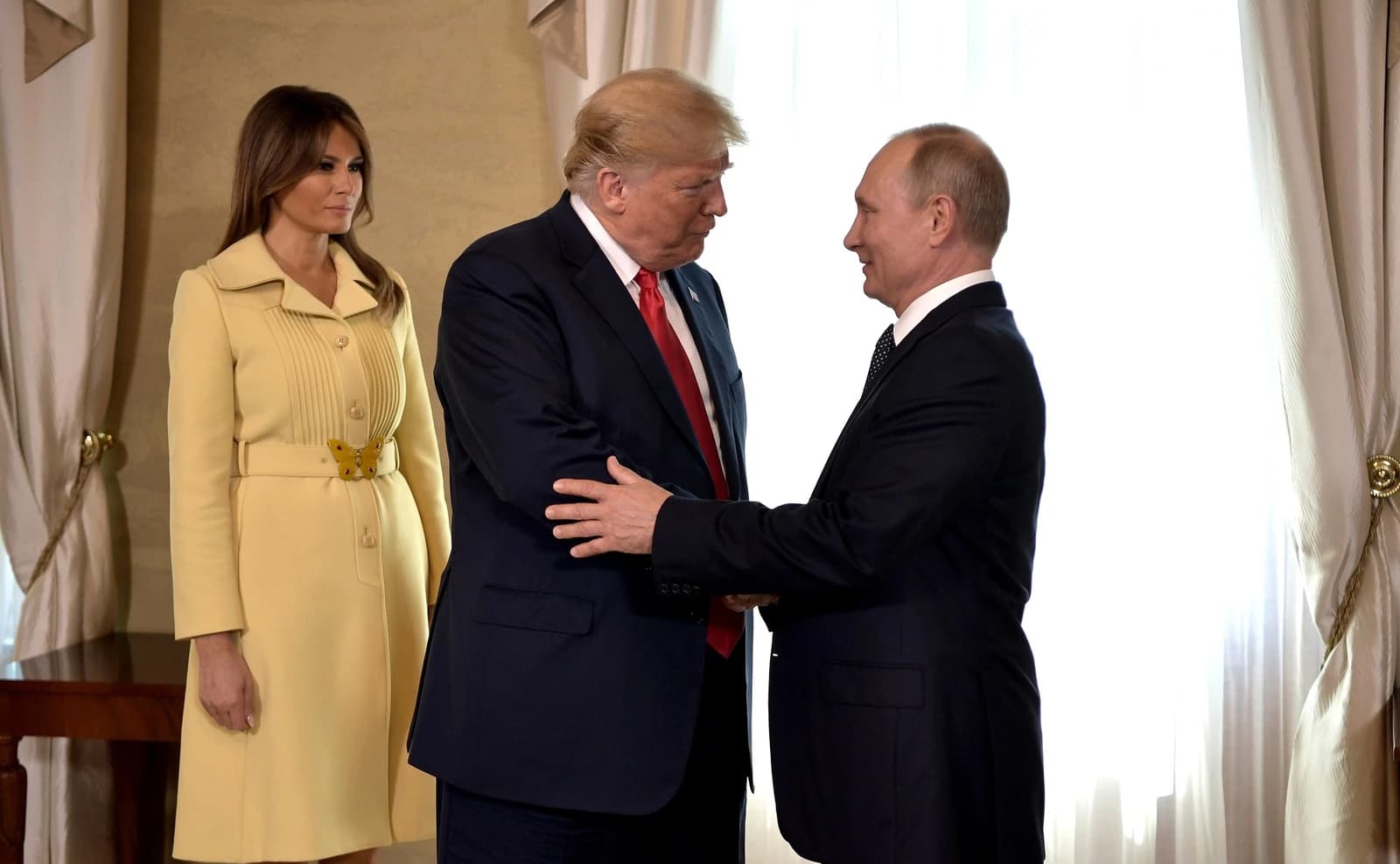President Donald Trump and President Vladimir Putin shaking hands in Helsinki.