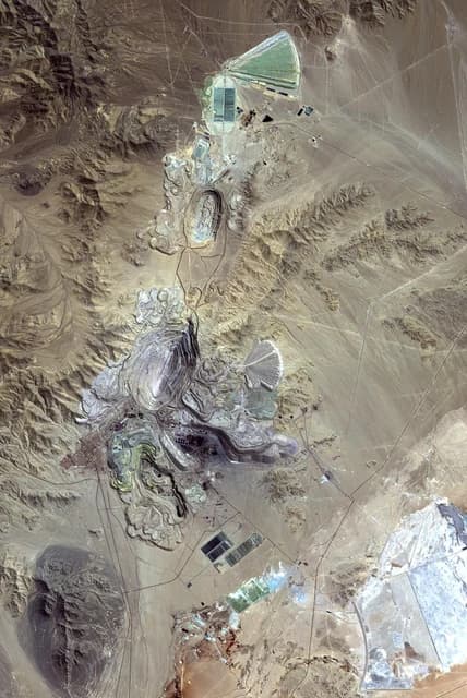 Aerial view showing the vast open-pit Chiquicamata copper mine in Chile.