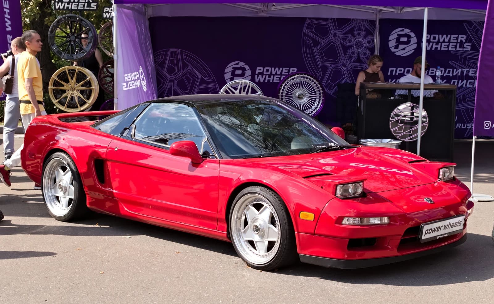 Red Honda NSX sports car displayed at the Moscow car show.