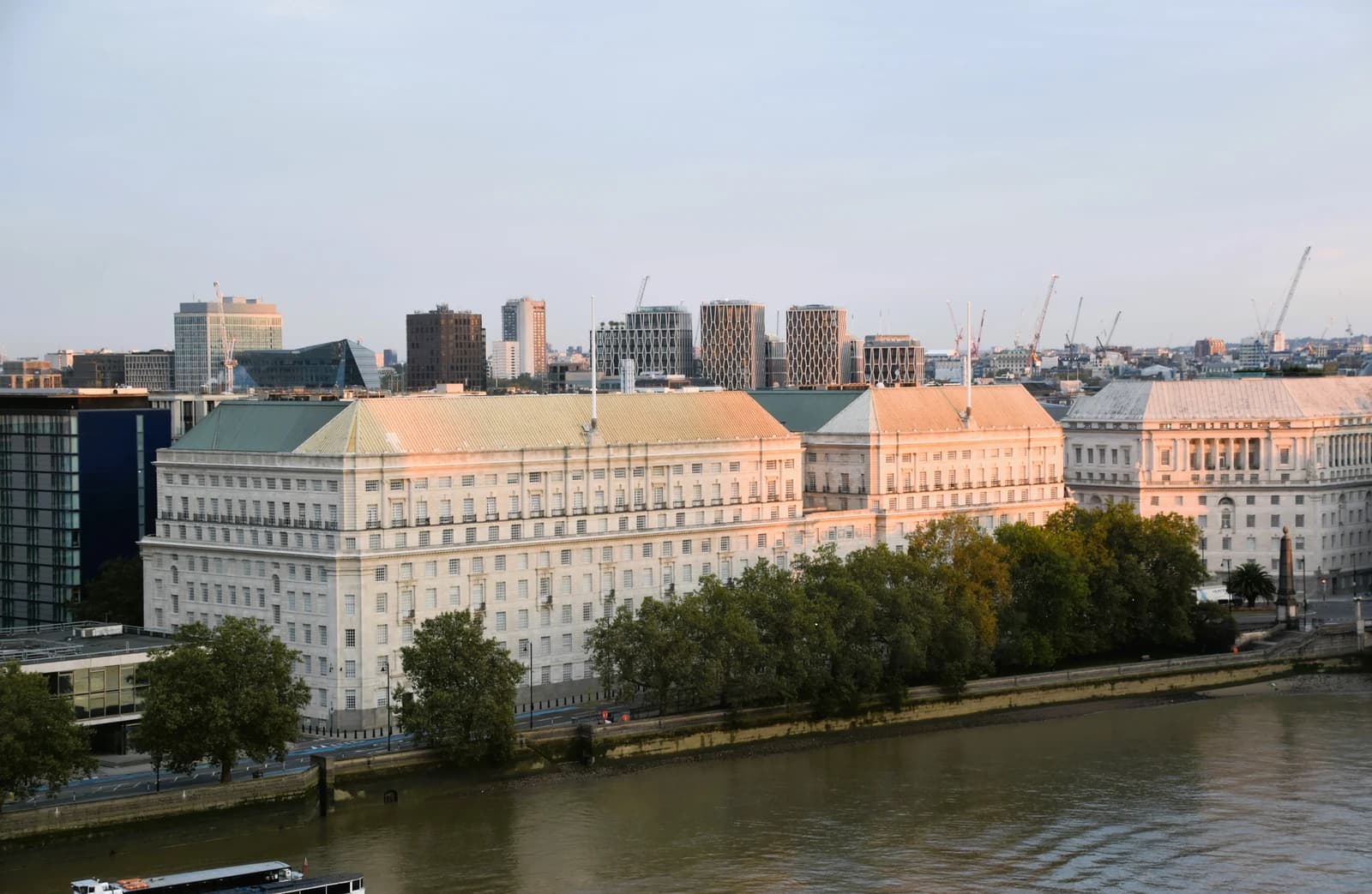 Exterior view of the MI5 Security Office building by the Thames River in London, England.