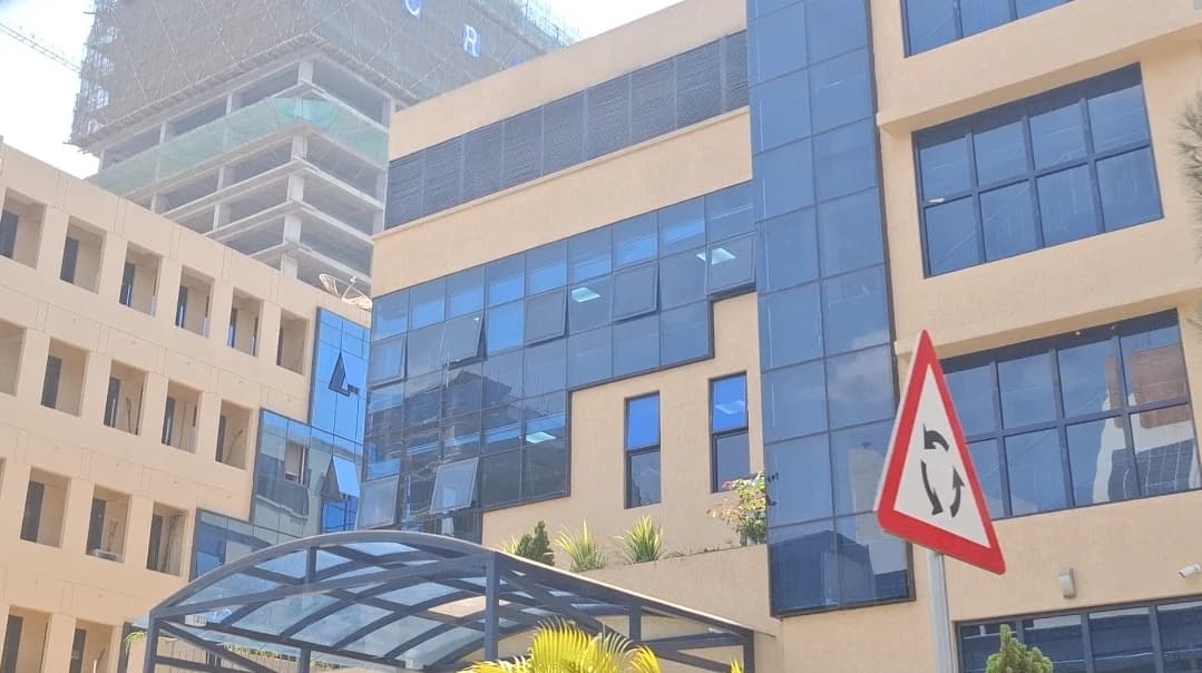 Ministry of Finance and Economic Planning building exterior with glass windows in Kigali.