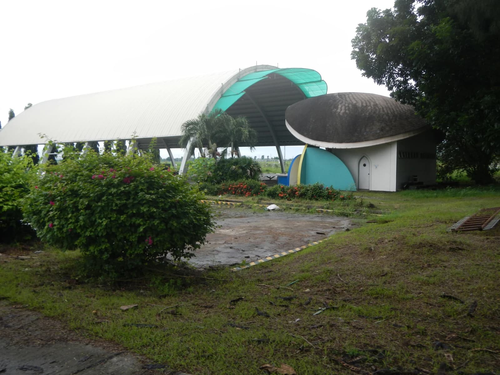Building and covered structure at Philippine Rice Research Institute in Muñoz, Nueva Ecija, Philippines.