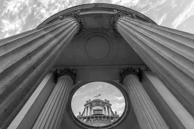View looking up at the Bank of England Museum building with classical columns.