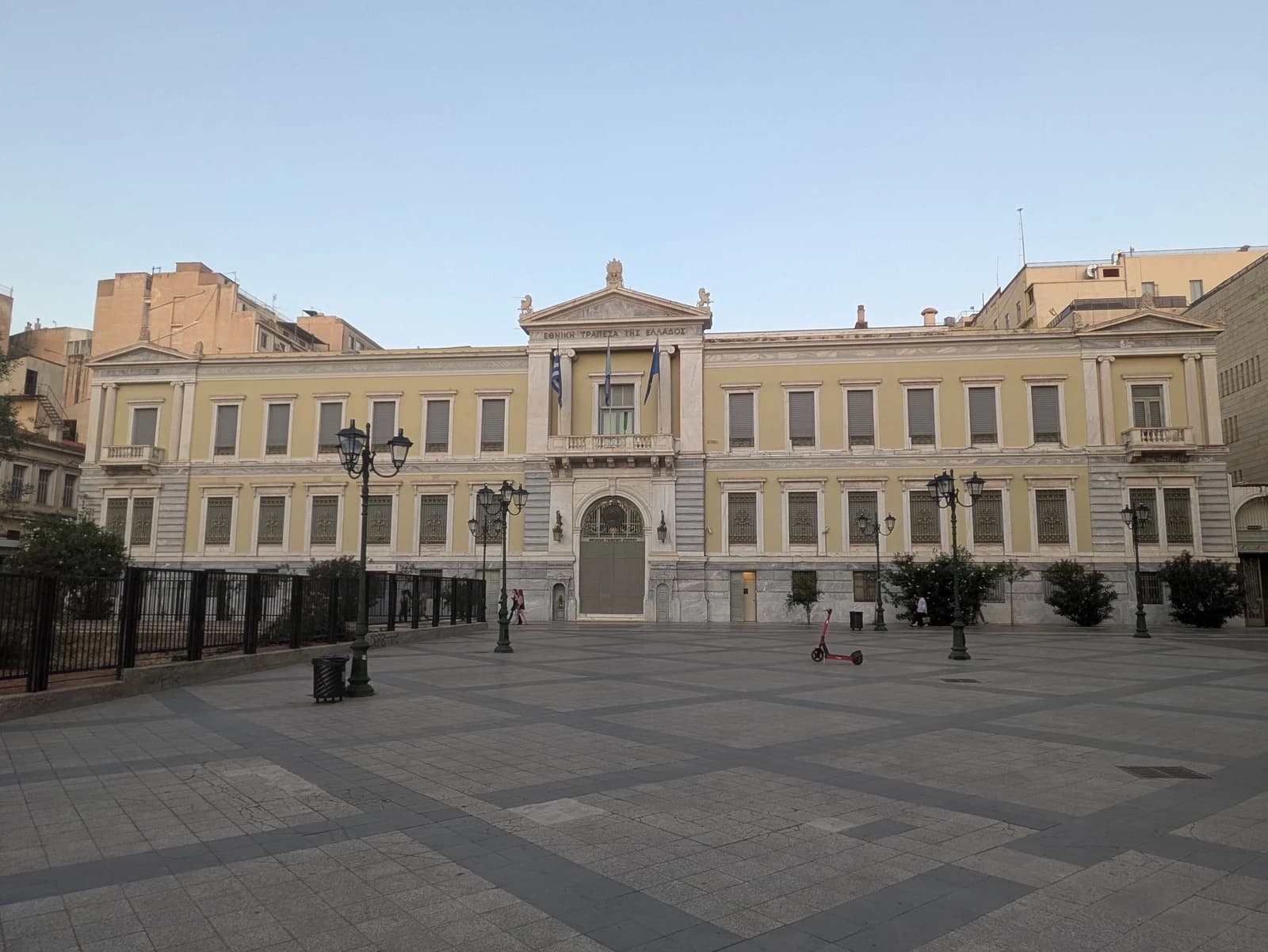 Exterior of the National Bank of Greece building in Athens, Greece, on a clear day.