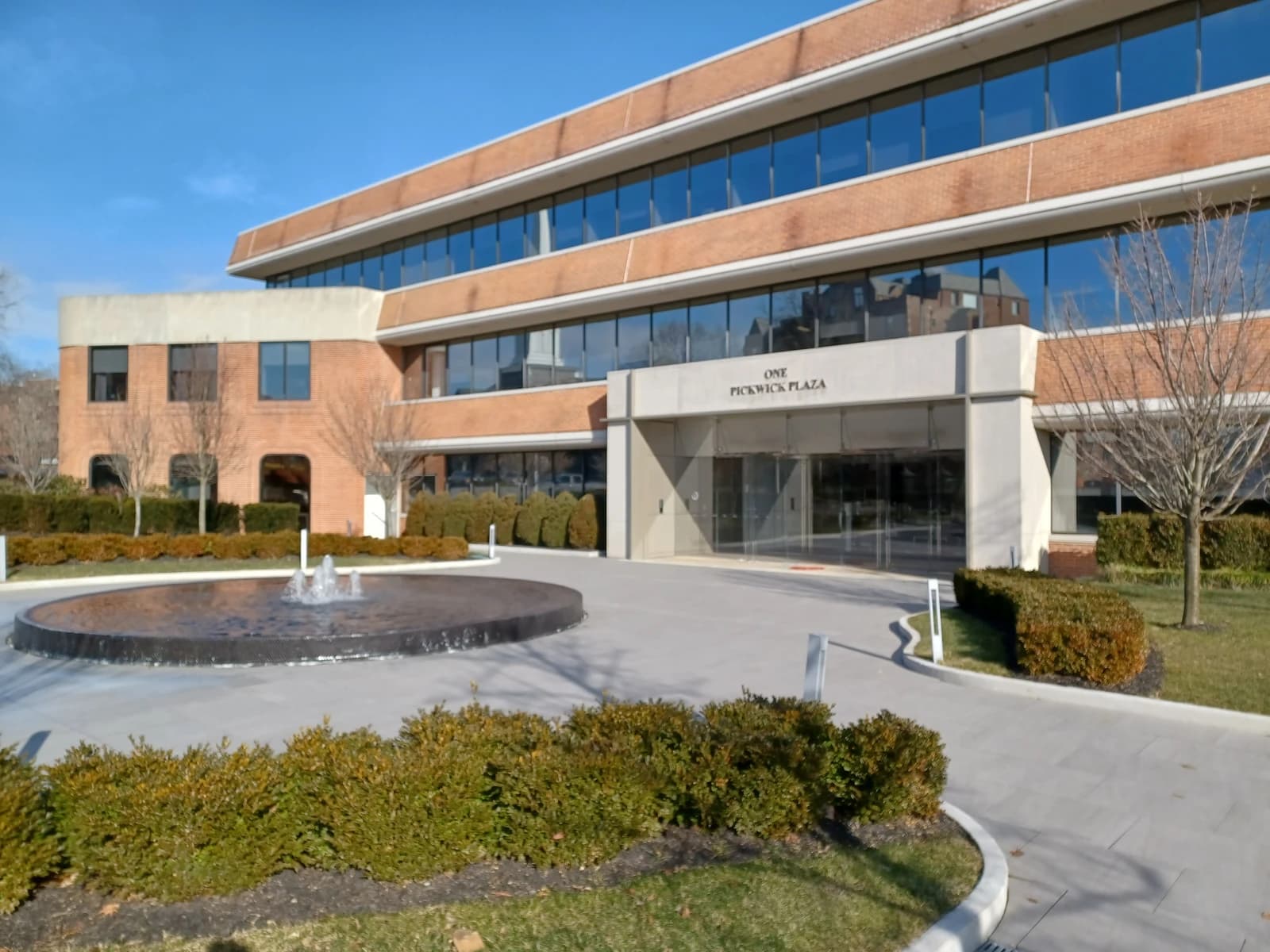Exterior view of the One Pickwick Plaza building, a brick office structure.
