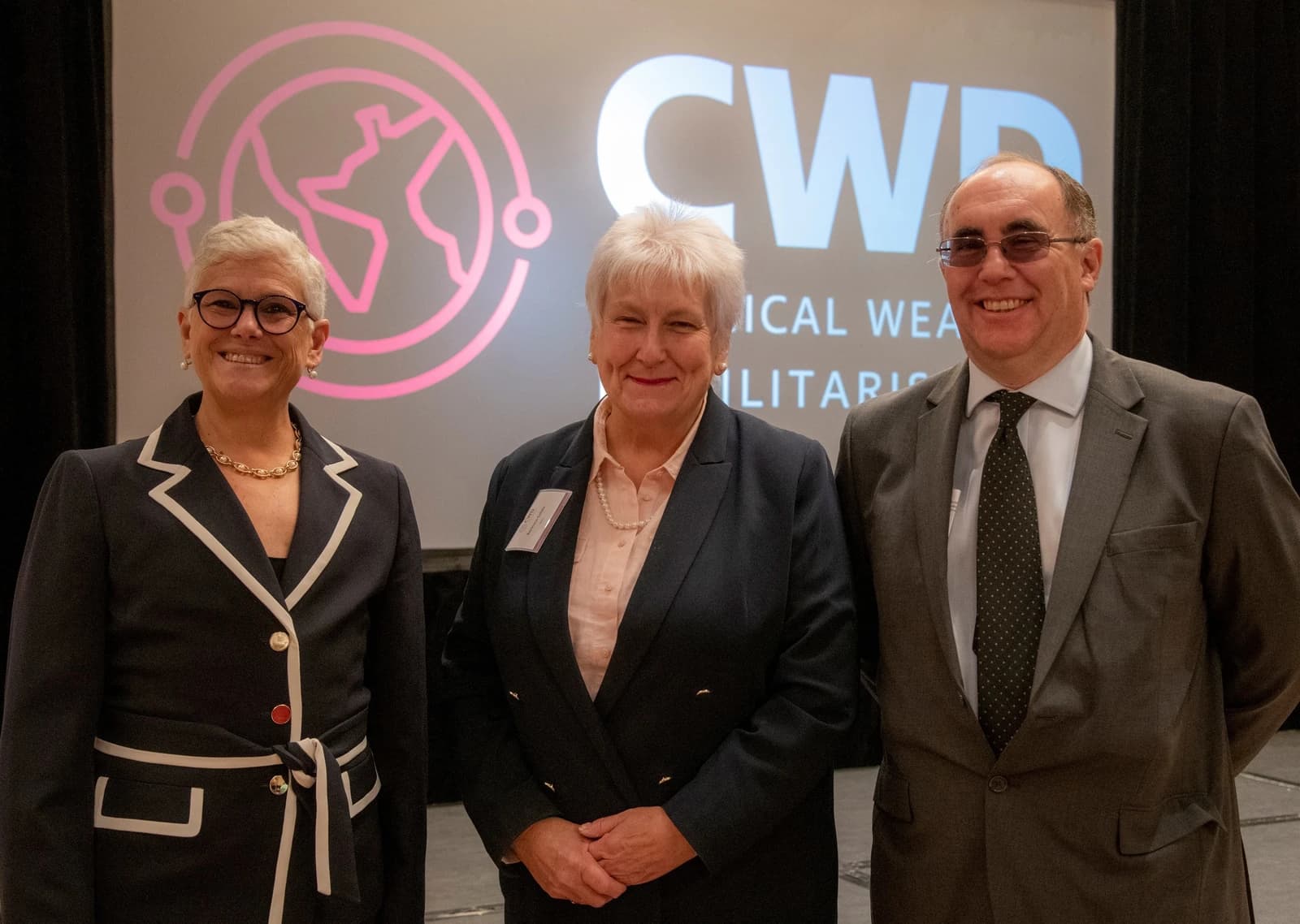 Deborah Rosenblum, Assistant Secretary of Defense for Nuclear, Chemical, and Biological Defense Programs, stands with two colleagues.