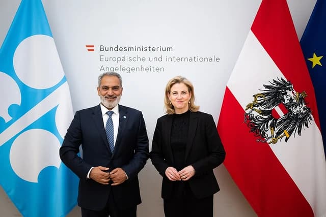 OPEC Secretary General Haitham Al Ghais and Austrian Foreign Minister Beate Meinl-Reisinger standing together.